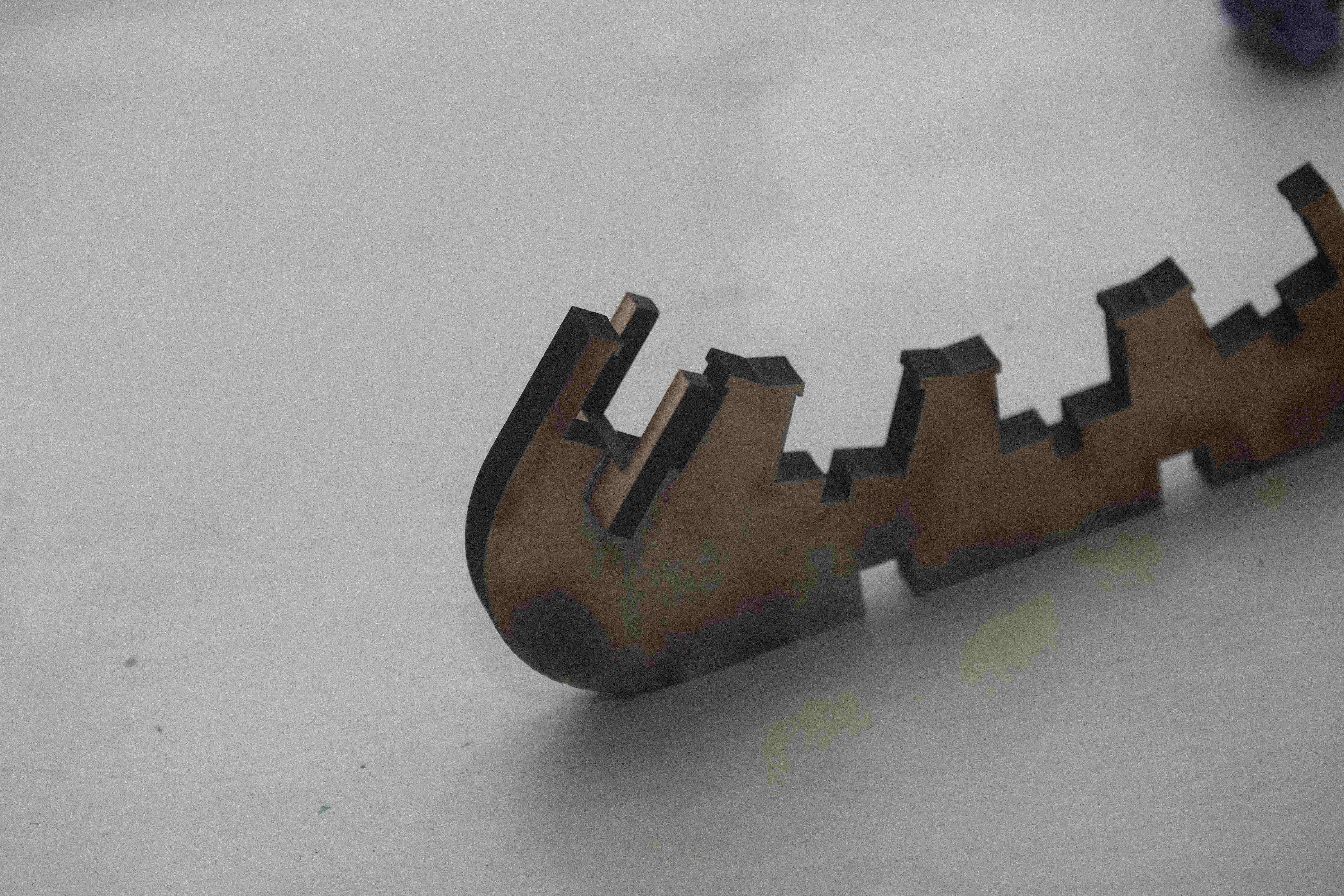 a C-shaped clip, made of wood